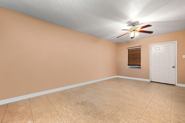 unfurnished room with baseboards, a textured ceiling, and ceiling fan