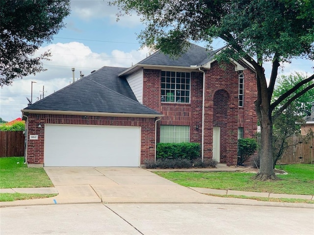 traditional home with concrete driveway, brick siding, fence, and an attached garage