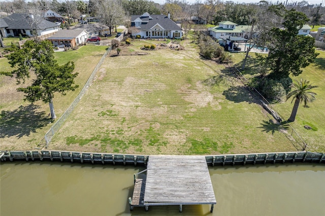 bird's eye view with a residential view and a water view