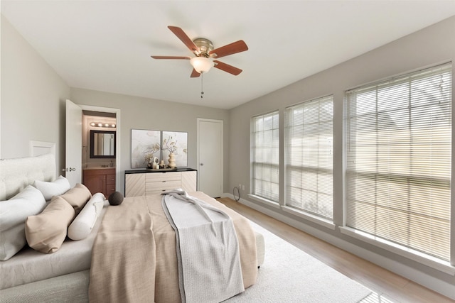 bedroom with a ceiling fan and ensuite bathroom