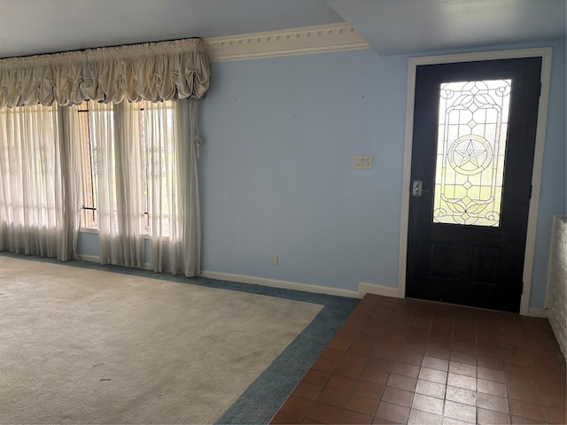 carpeted entryway with baseboards