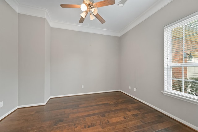 spare room featuring ornamental molding, wood finished floors, visible vents, and baseboards