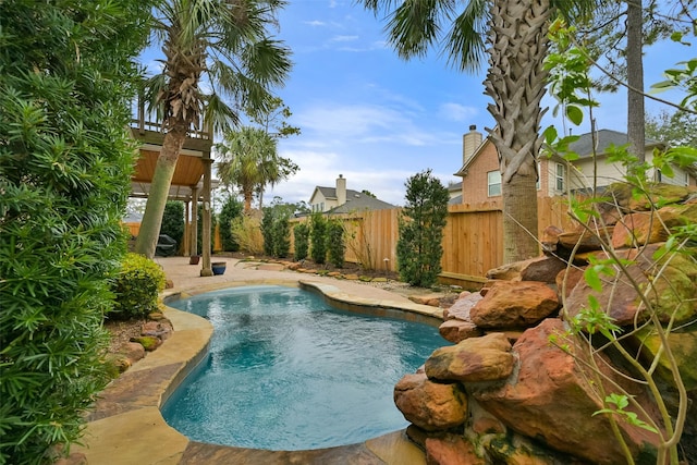 view of pool with fence and a patio