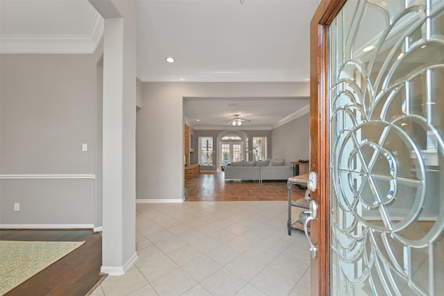 foyer with baseboards, ceiling fan, ornamental molding, light tile patterned flooring, and recessed lighting