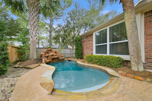 view of swimming pool featuring a fenced in pool and a fenced backyard