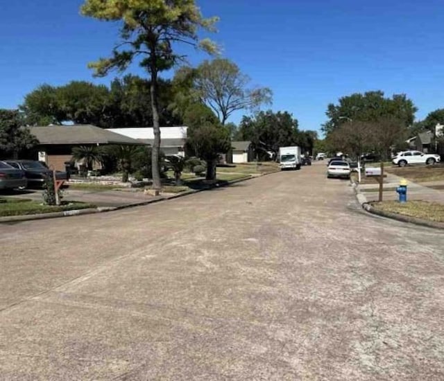 view of street with curbs