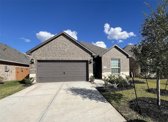 single story home featuring driveway, roof with shingles, a garage, and brick siding