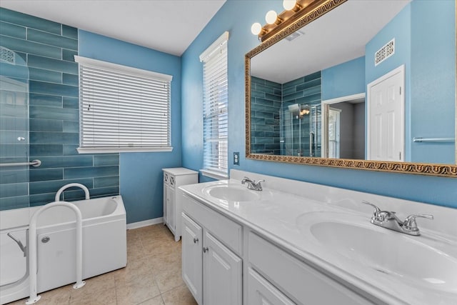 full bath with tile patterned floors, a sink, a bath, and a shower stall