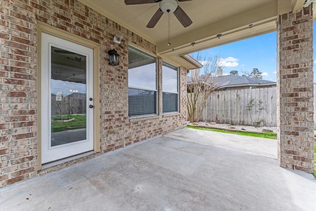 view of patio / terrace featuring fence and a ceiling fan