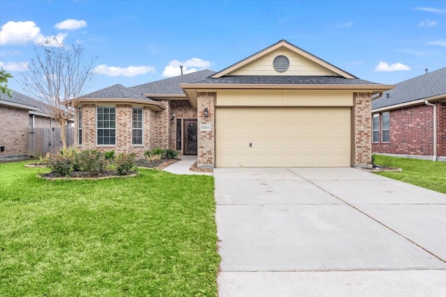 ranch-style house with a garage, concrete driveway, brick siding, and a front lawn