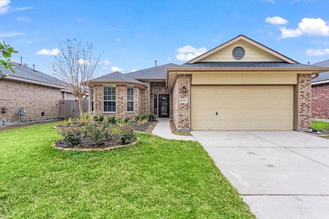 ranch-style home featuring a garage, concrete driveway, fence, a front lawn, and brick siding