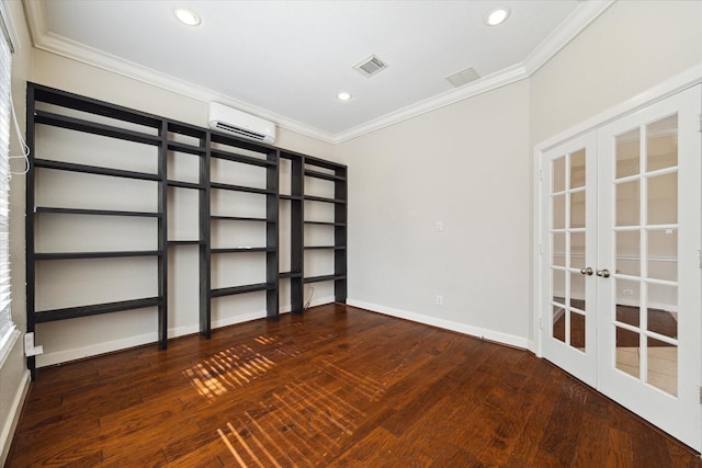 spare room featuring french doors, a wall mounted air conditioner, visible vents, and crown molding