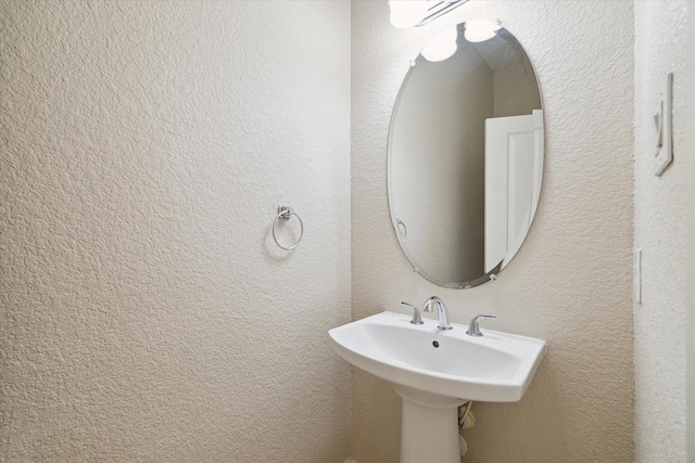 bathroom with a textured wall