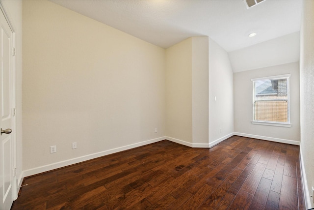 unfurnished room with baseboards, vaulted ceiling, dark wood-type flooring, and recessed lighting