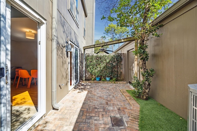 view of patio featuring fence