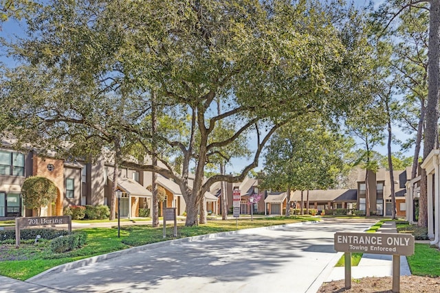 exterior space featuring a residential view and curbs