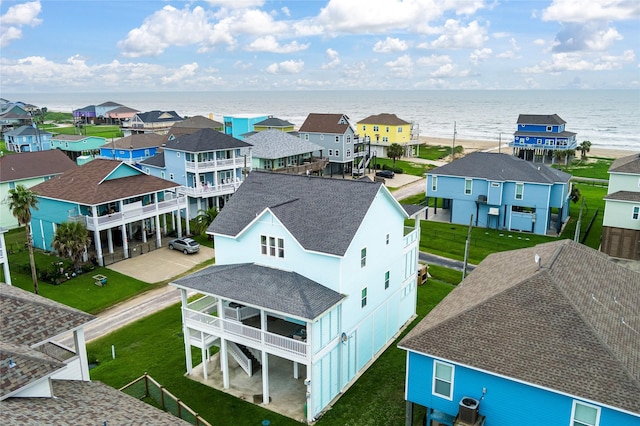 birds eye view of property with a residential view and a water view