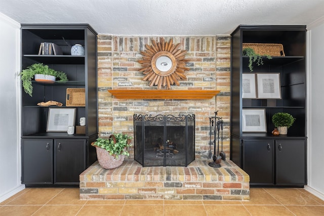 tiled living area featuring baseboards, a fireplace, built in features, and a textured ceiling