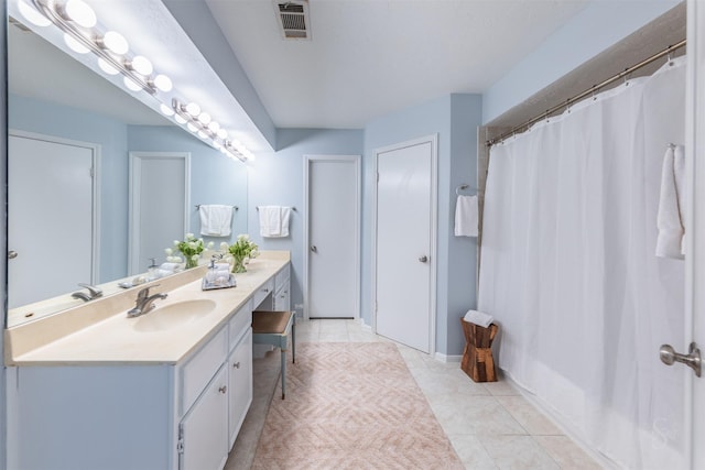 full bath featuring curtained shower, visible vents, vanity, and tile patterned floors