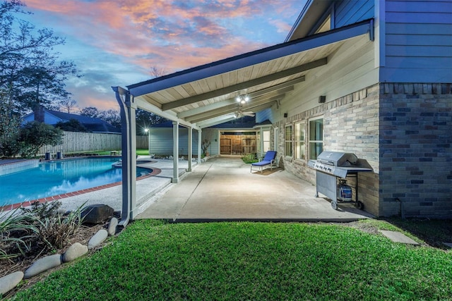 view of patio featuring a fenced in pool, a fenced backyard, and a grill