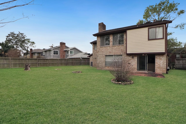 view of yard with a fenced backyard