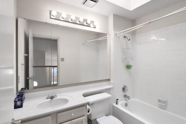 bathroom featuring vanity, bathing tub / shower combination, toilet, and visible vents