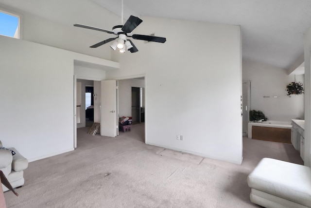 bedroom with light colored carpet, ceiling fan, and vaulted ceiling