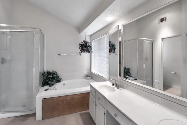 bathroom featuring visible vents, a stall shower, a sink, double vanity, and a bath