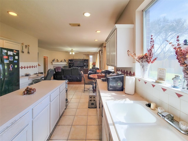8002 Weeping Willow Pl, Missouri City, TX 77459 - kitchen featuring visible vents, light tile patterned flooring, light countertops, and freestanding refrigerator