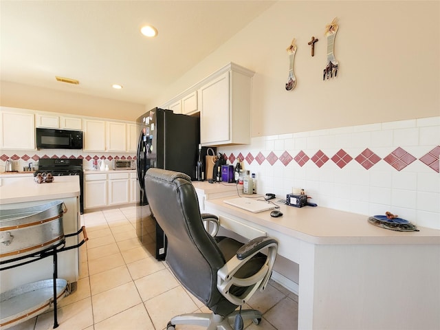 8002 Weeping Willow Pl, Missouri City, TX 77459 - kitchen with light tile patterned floors, range, black microwave, and light countertops