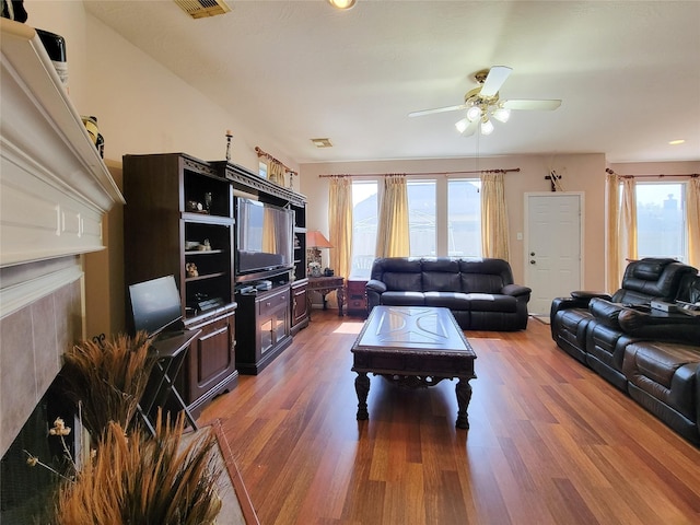 8002 Weeping Willow Pl, Missouri City, TX 77459 - living room featuring a healthy amount of sunlight, ceiling fan, and wood finished floors