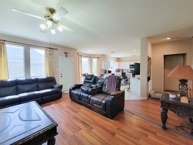 8002 Weeping Willow Pl, Missouri City, TX 77459 - living room with recessed lighting, a ceiling fan, and light wood-style floors