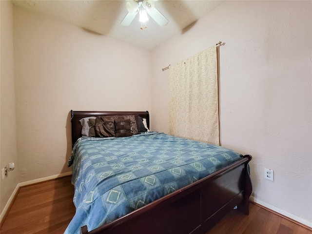 8002 Weeping Willow Pl, Missouri City, TX 77459 - bedroom with ceiling fan, baseboards, and wood finished floors