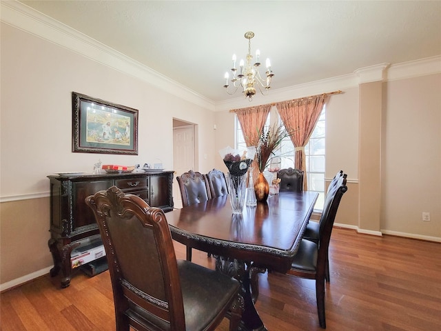 8002 Weeping Willow Pl, Missouri City, TX 77459 - dining room featuring baseboards, an inviting chandelier, wood finished floors, and crown molding