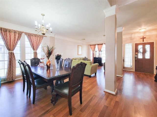 8002 Weeping Willow Pl, Missouri City, TX 77459 - dining space with wood finished floors, baseboards, ornate columns, crown molding, and a notable chandelier