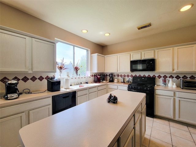 8002 Weeping Willow Pl, Missouri City, TX 77459 - kitchen featuring light tile patterned floors, visible vents, black appliances, light countertops, and backsplash