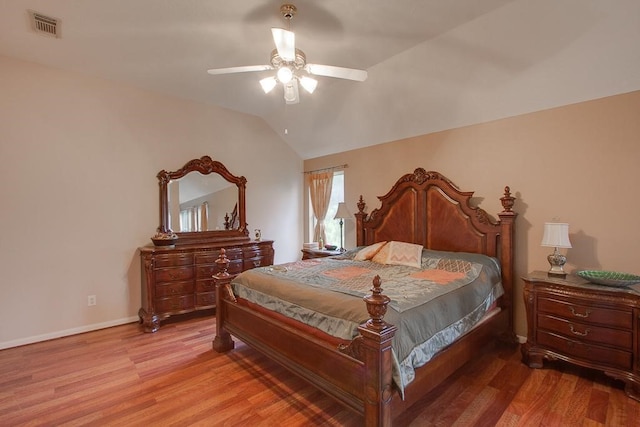 8002 Weeping Willow Pl, Missouri City, TX 77459 - bedroom with light wood-type flooring, visible vents, baseboards, and vaulted ceiling