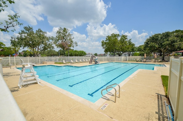 8002 Weeping Willow Pl, Missouri City, TX 77459 - community pool featuring a patio, a water slide, and fence