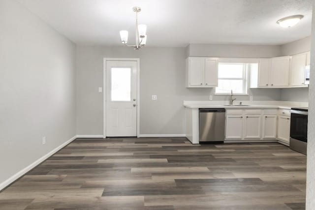 kitchen featuring a sink, stainless steel appliances, baseboards, and dark wood-style floors