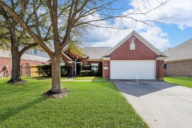 view of front of home featuring brick siding, concrete driveway, an attached garage, fence, and a front yard