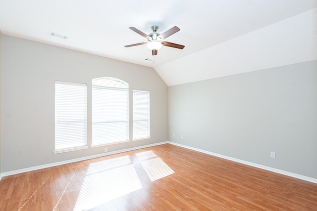 unfurnished room with light wood-style flooring, visible vents, and baseboards