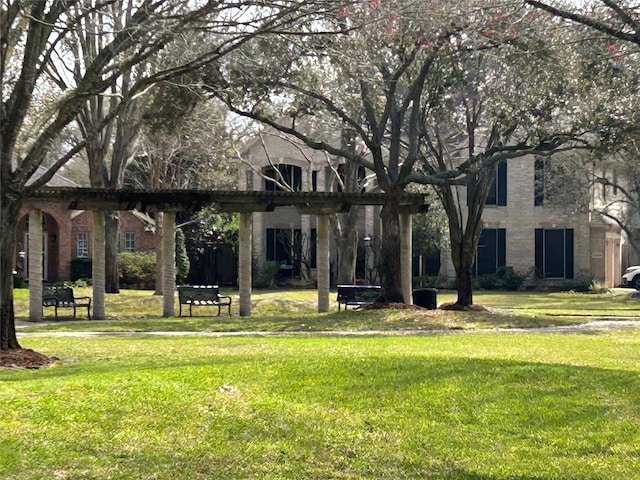 view of community with a yard