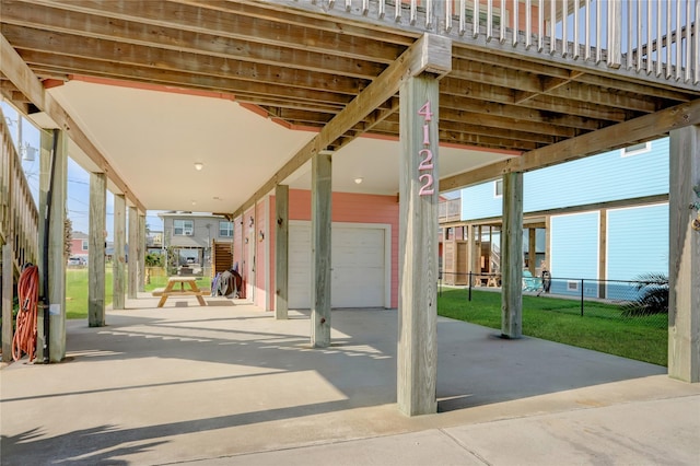 surrounding community with an attached garage, fence, a lawn, and concrete driveway