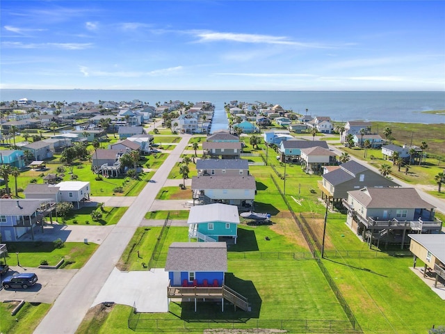 bird's eye view featuring a water view and a residential view