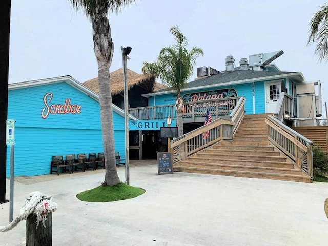 4122 Reeves Dr, Galveston, TX 77554 - view of building exterior with stairs