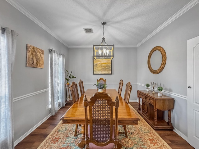 dining area with visible vents, baseboards, dark wood-type flooring, and an inviting chandelier