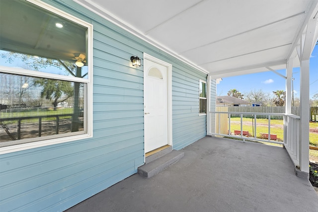 view of patio / terrace with covered porch and fence