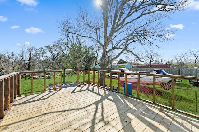 deck with fence and a lawn