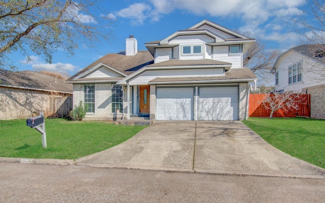 traditional home with driveway, a chimney, fence, a front yard, and brick siding