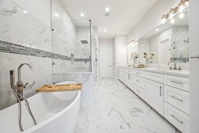 902 Knox St Unit A, Houston, TX 77007 - full bathroom with a marble finish shower, double vanity, a soaking tub, marble finish flooring, and recessed lighting